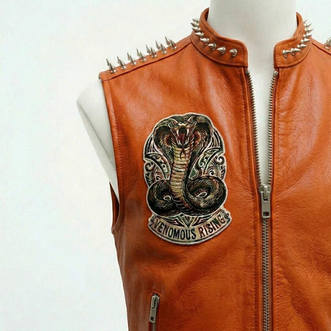 Men Orange Leather Vest with Embroidered Cobra Patch and Studded Detail
