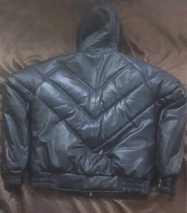 Men's black leather jacket showing zipper closure