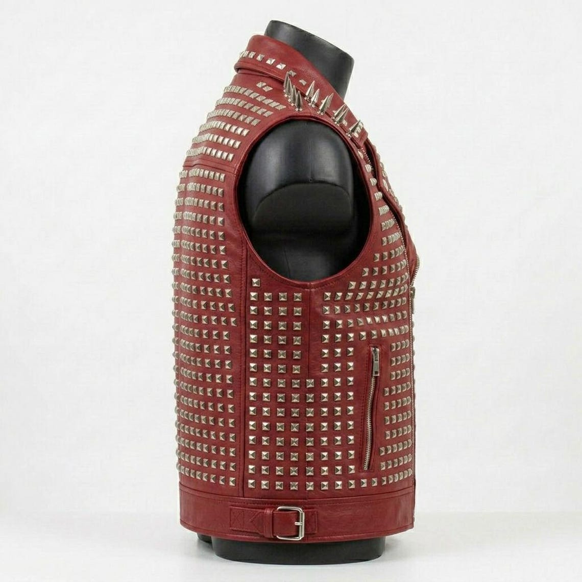 Side angle of red leather biker vest men with metal studs