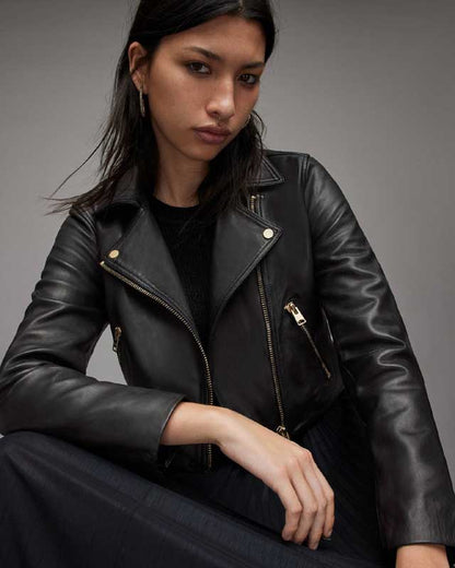 Cropped black leather jacket with double zipper closure