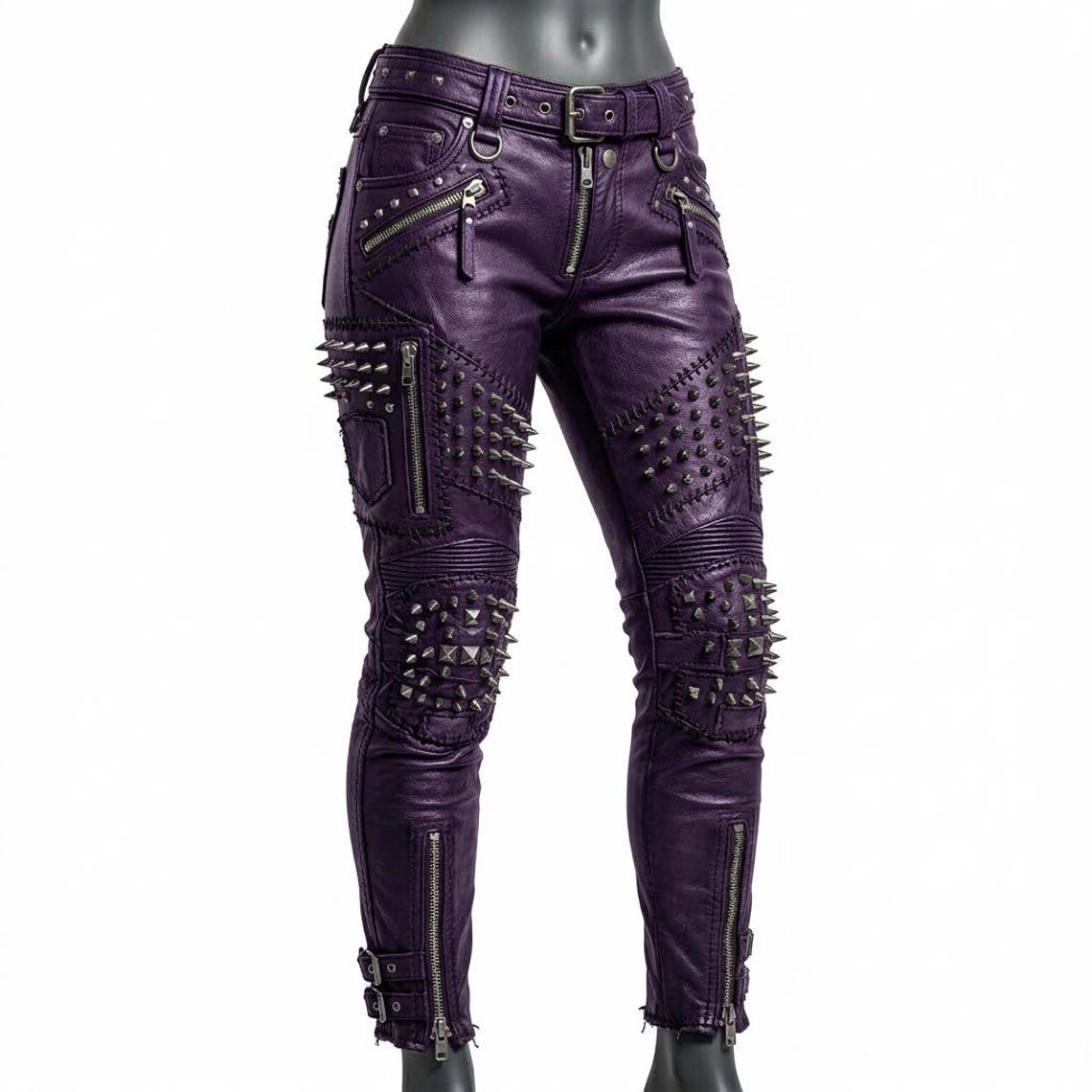 Front view of orange studded leather pant for women with skinny biker fit