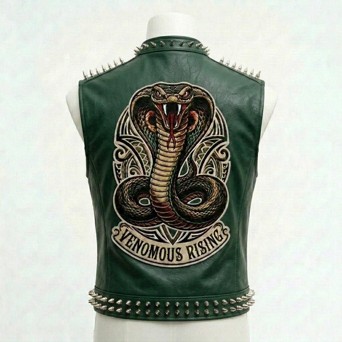 Back design of green leather biker vest with bold embroidery patchwork