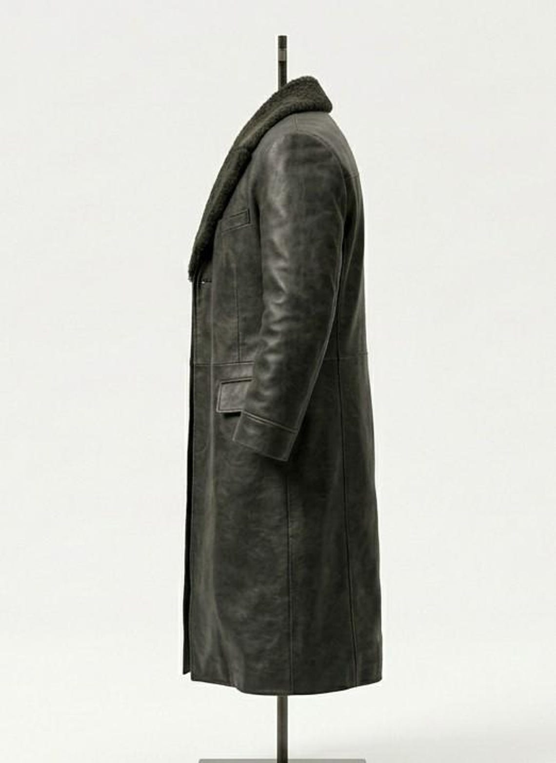 Side profile of mens winter leather overcoat with fur collar