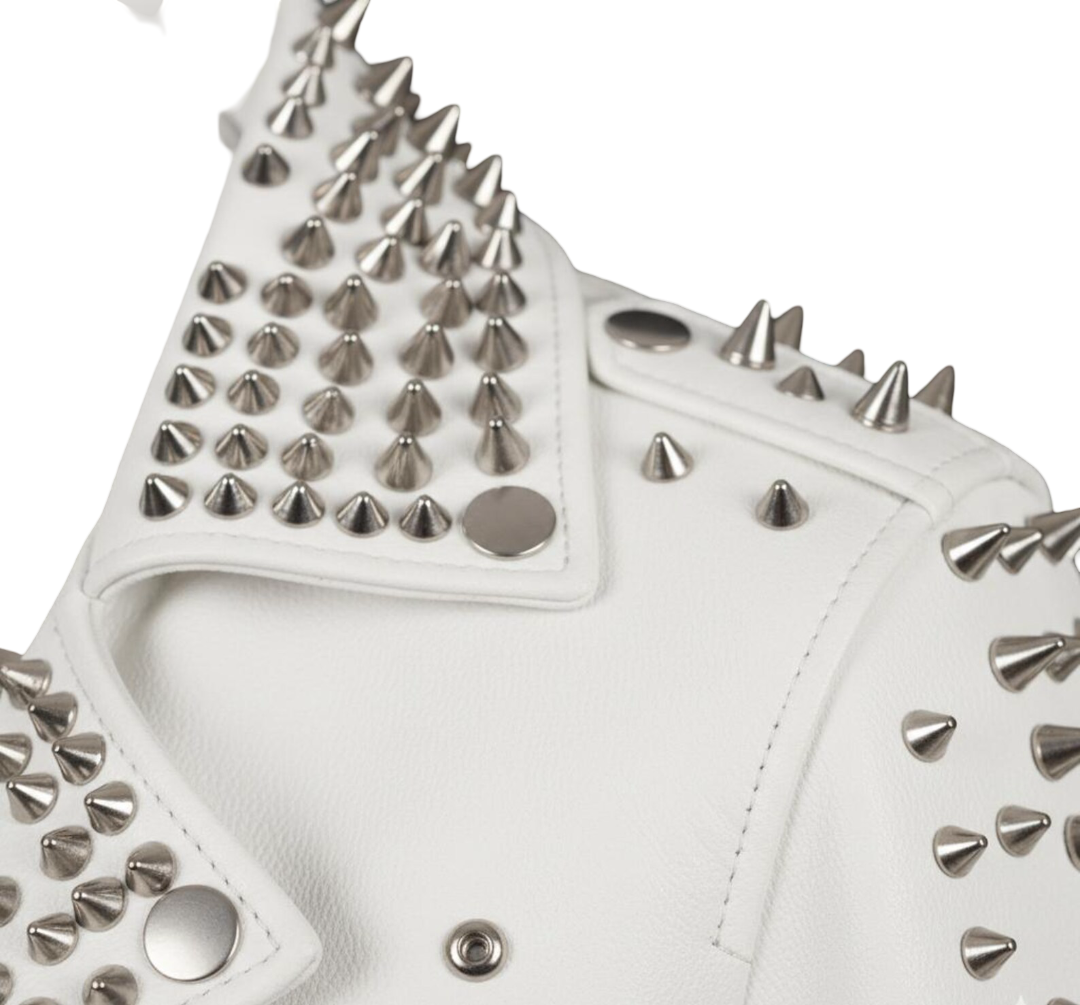  Close up detail of silver studs on white leather biker jacket