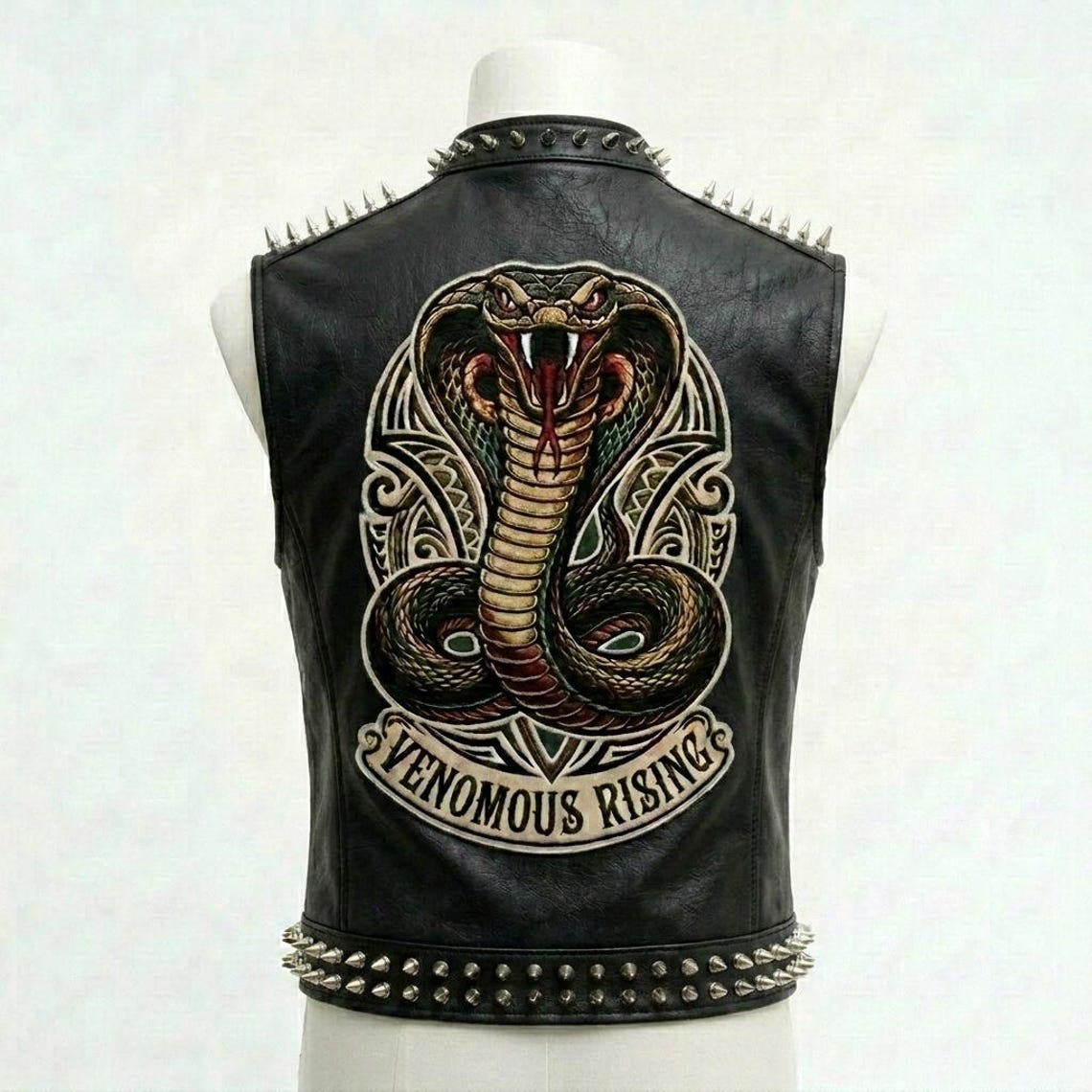 Back design of black leather biker vest with detailed embroidery