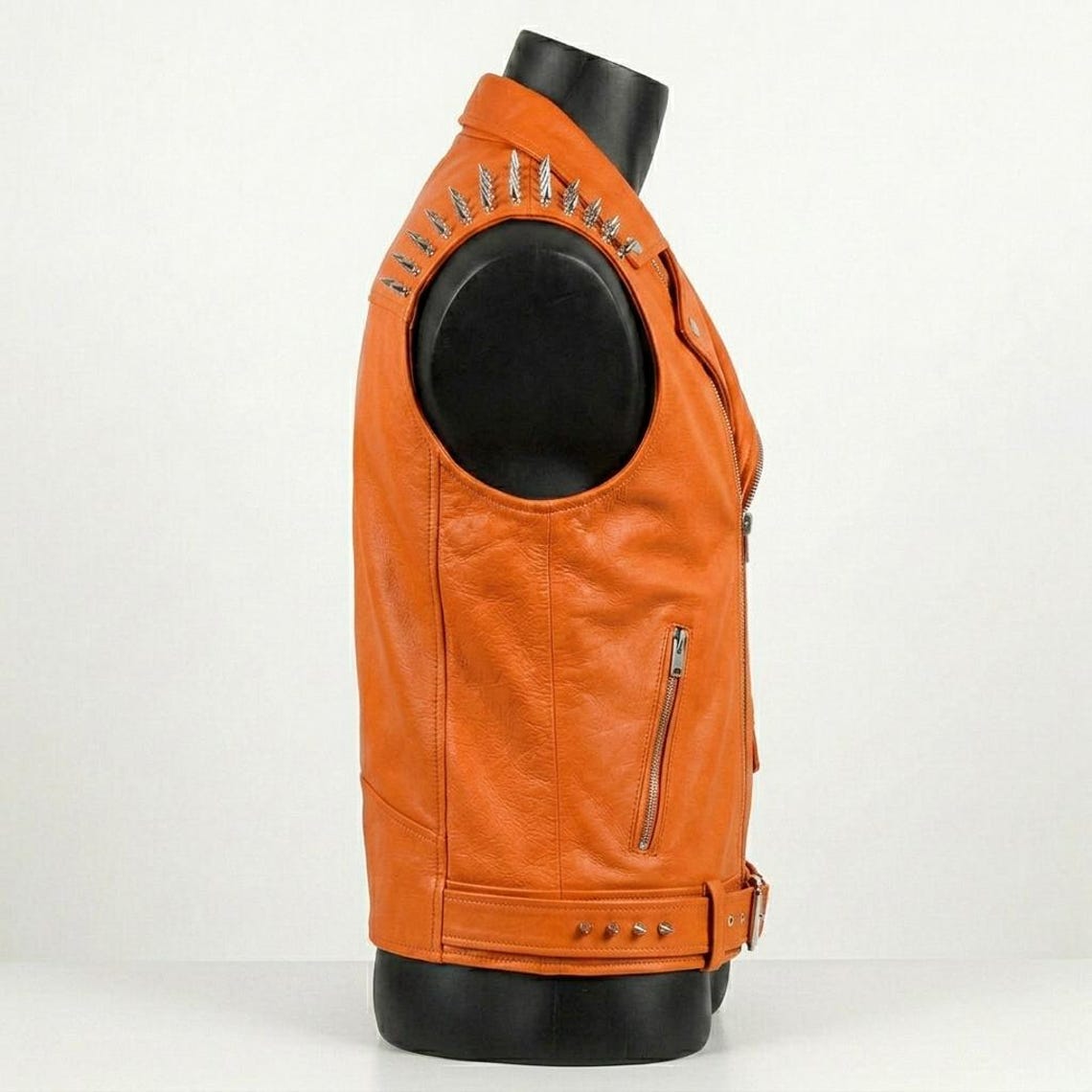 Side profile of men orange leather motorcycle vest