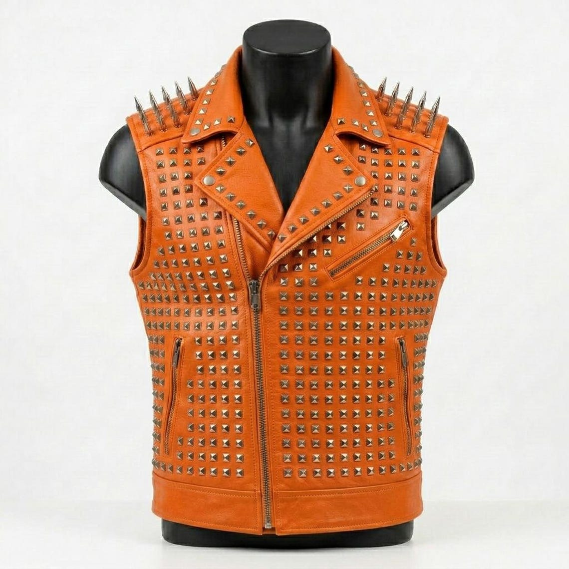 Front view of men orange studded leather vest with punk spikes