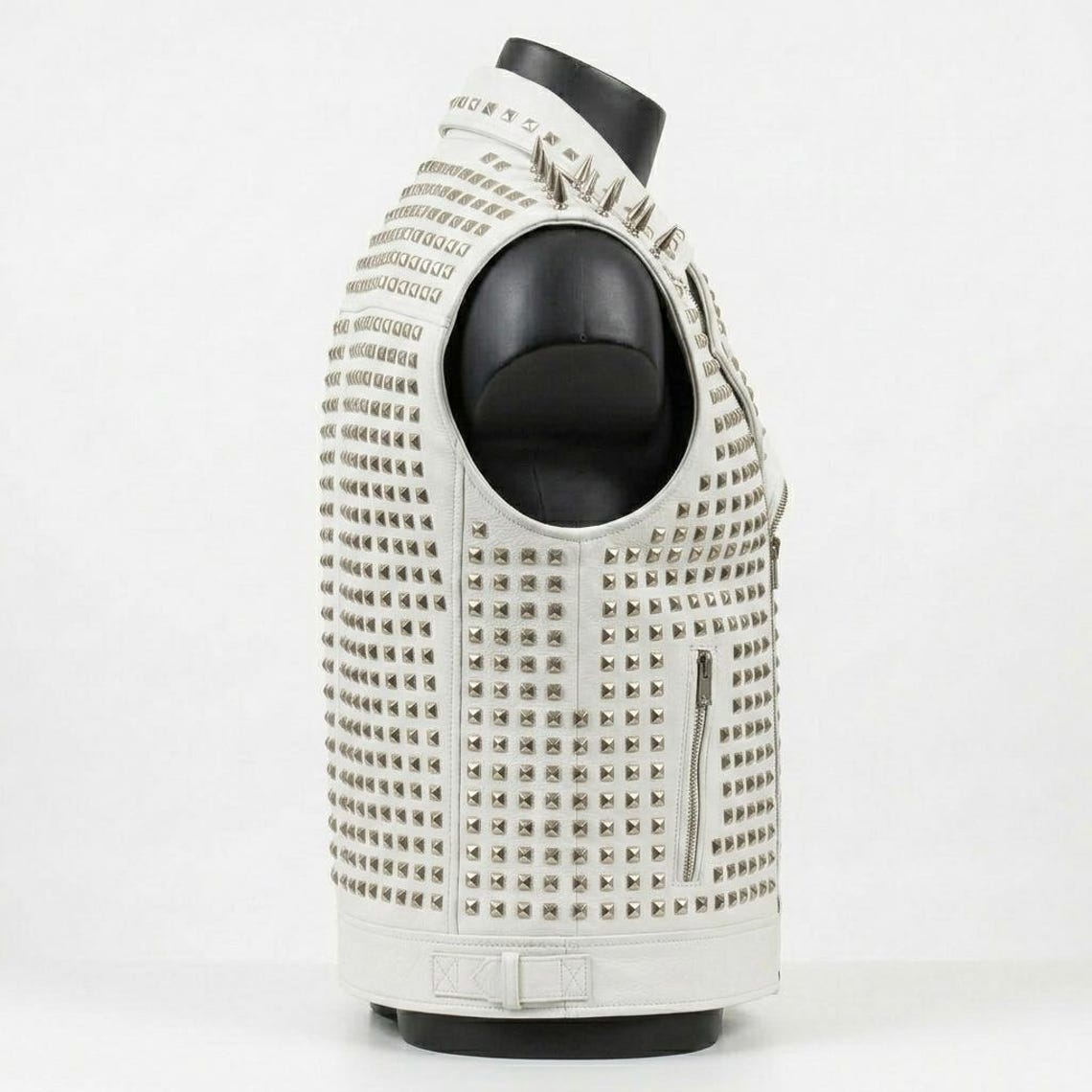 Side angle of men white leather spike vest for motorcycle style