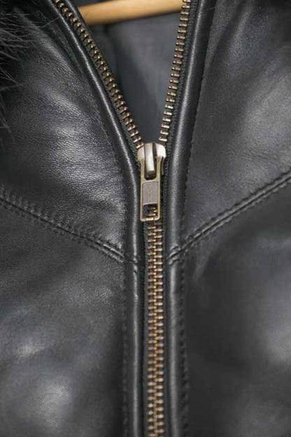 Close-up of V-chevron stitching on black leather jacket
