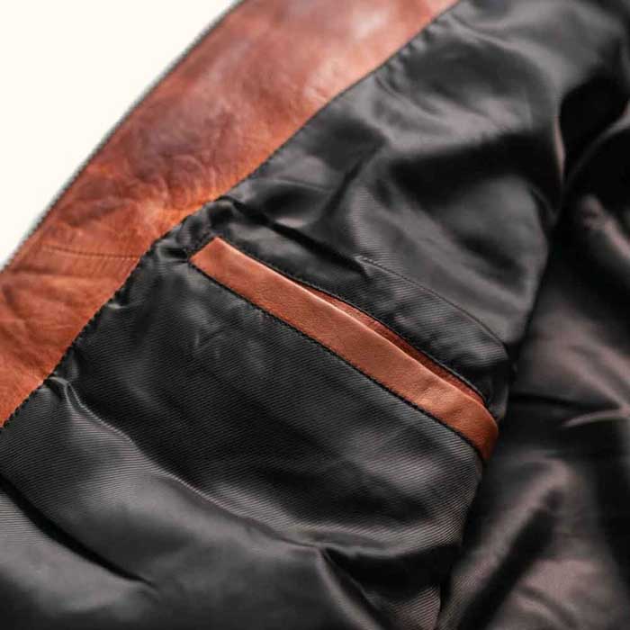 Cognac brown leather jacket side pocket close-up