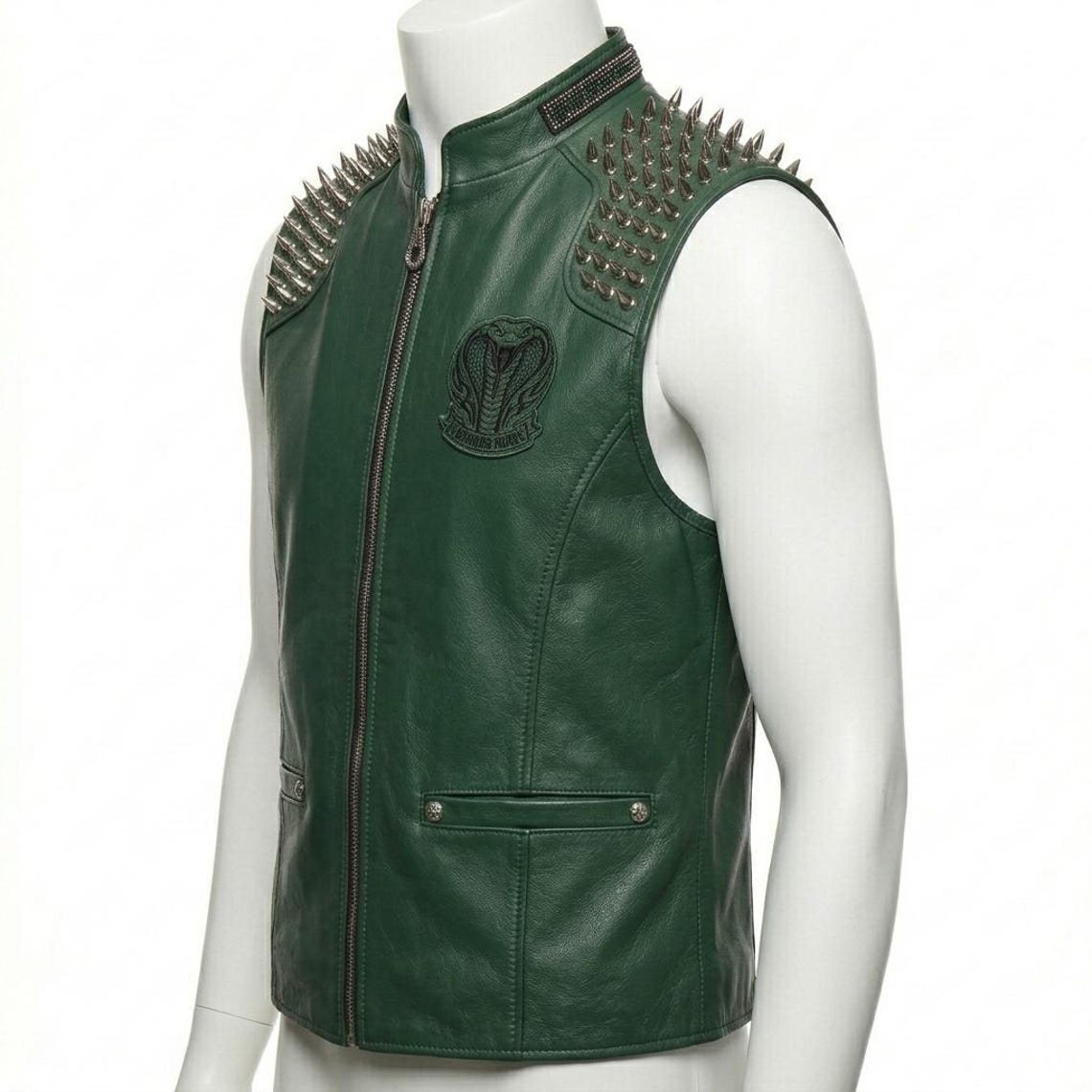Side view of men’s green leather biker vest with spike accents and embroidered gothic detailing