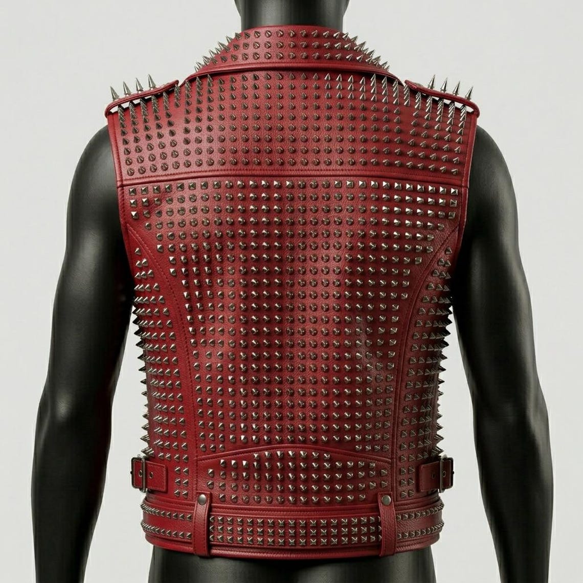 Back view of men red spike biker vest in genuine leather