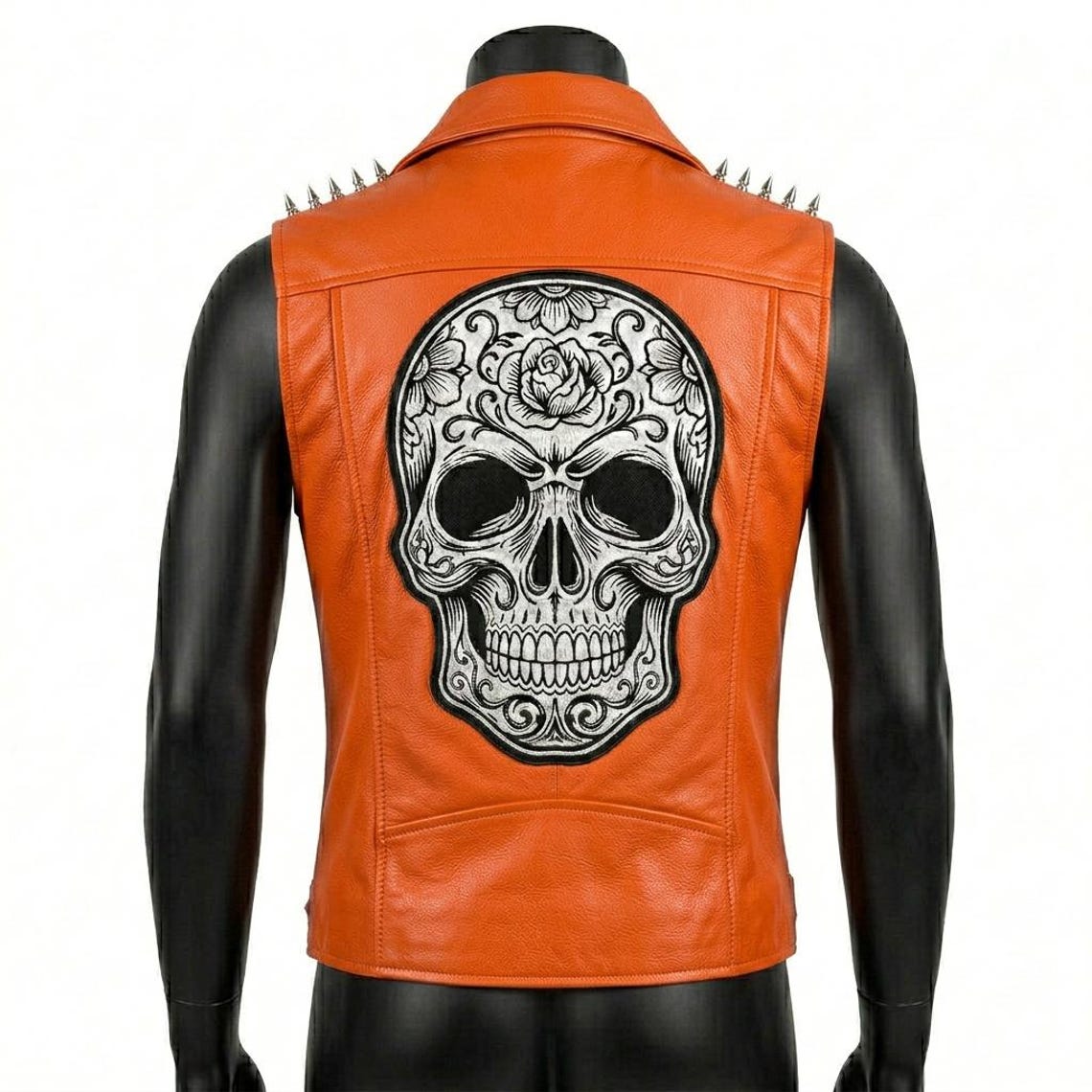 Back design of orange leather biker vest with bold detailing
