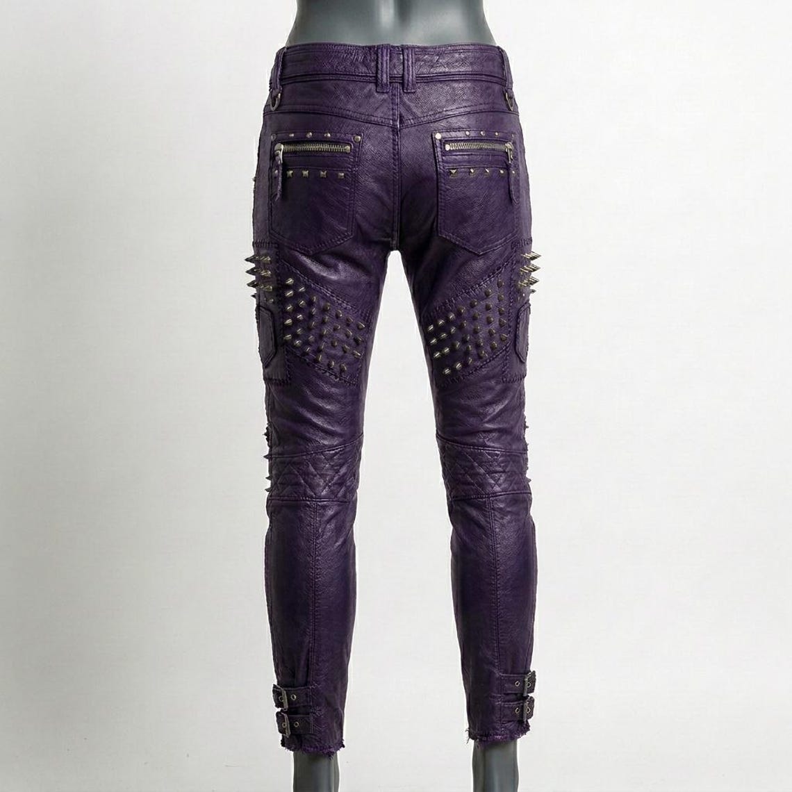 Back view of orange studded leather pant for women
