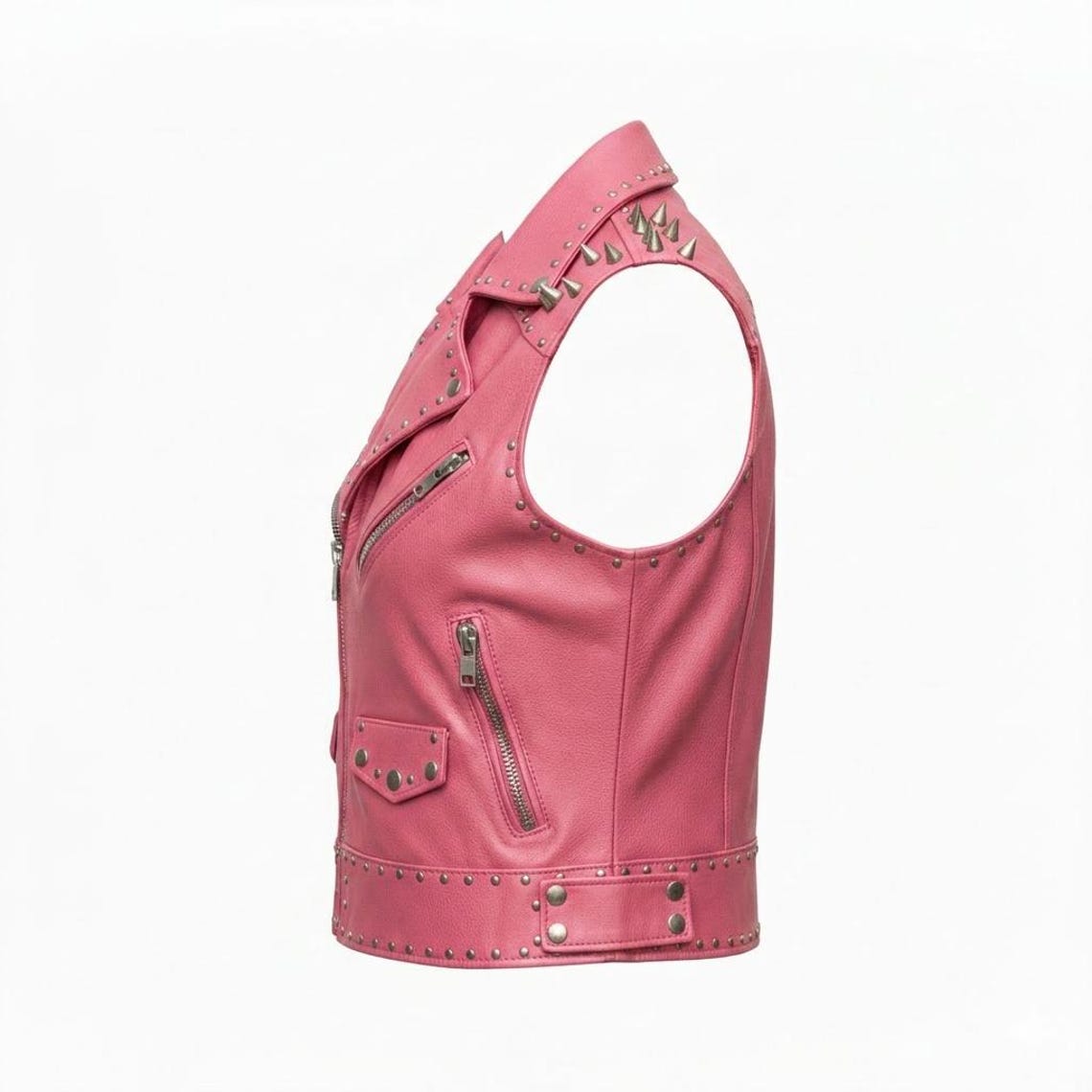 Side view of women pink studded leather biker vest showing spike detailing and fitted biker cut