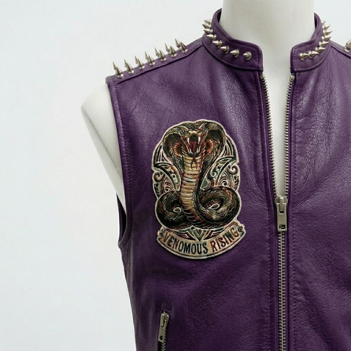Close up of studded detail on purple biker leather vest for men