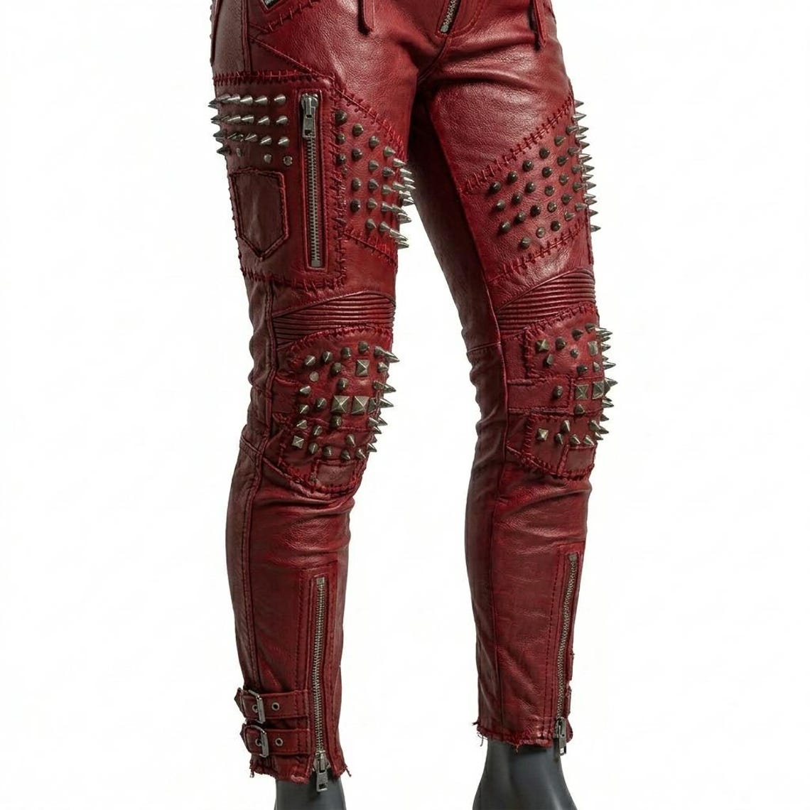 Side profile of red studded leather pant showing spike detail