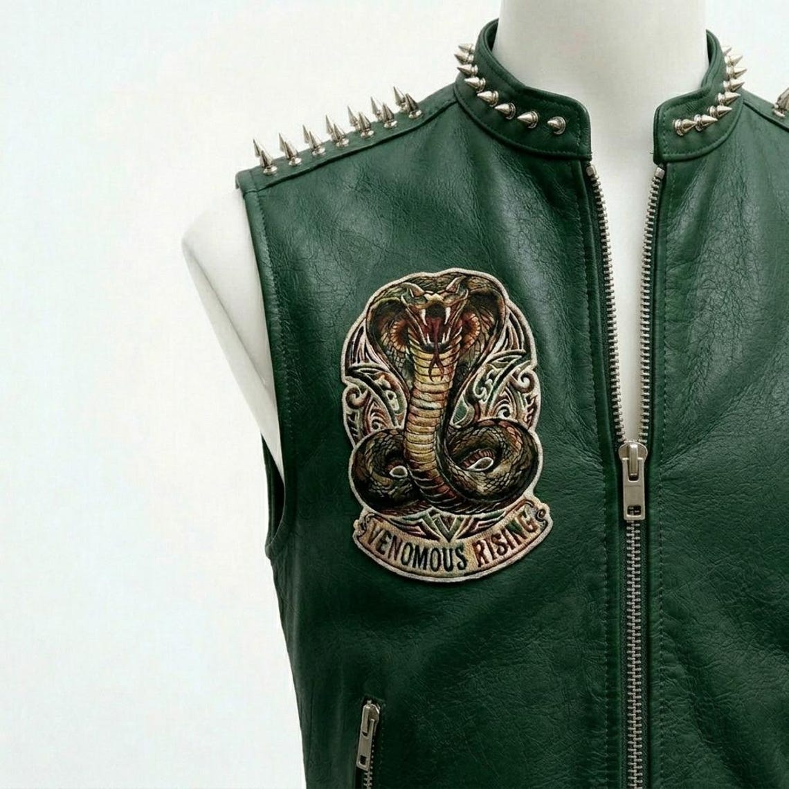 Close up of studded detail on men green leather biker waistcoat