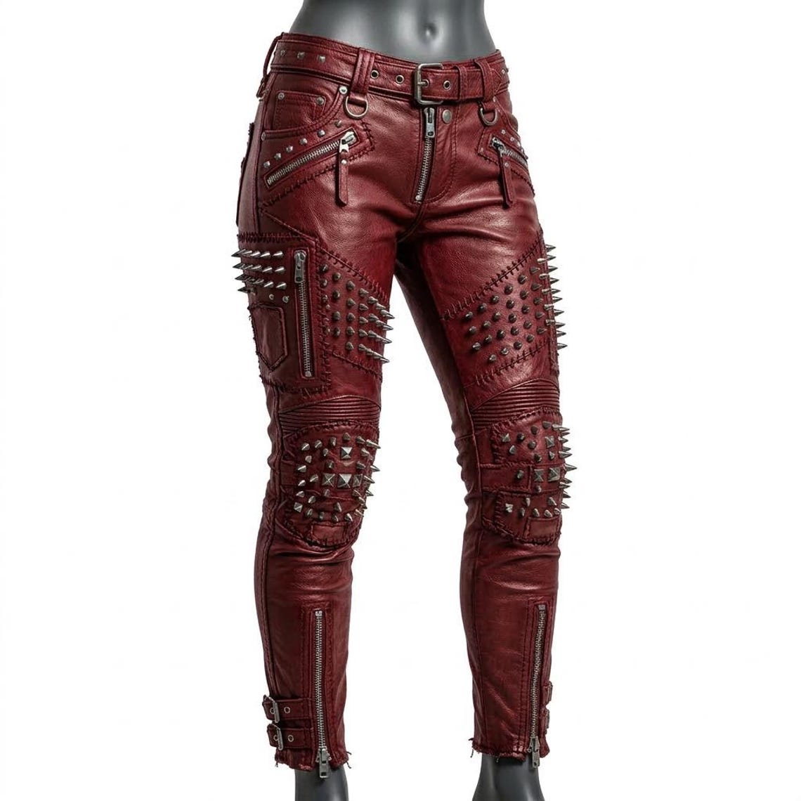  Front view of women red studded leather pant with skinny biker fit