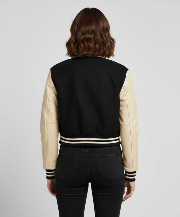 Black and cream women's letterman jacket featuring contrasting materials
