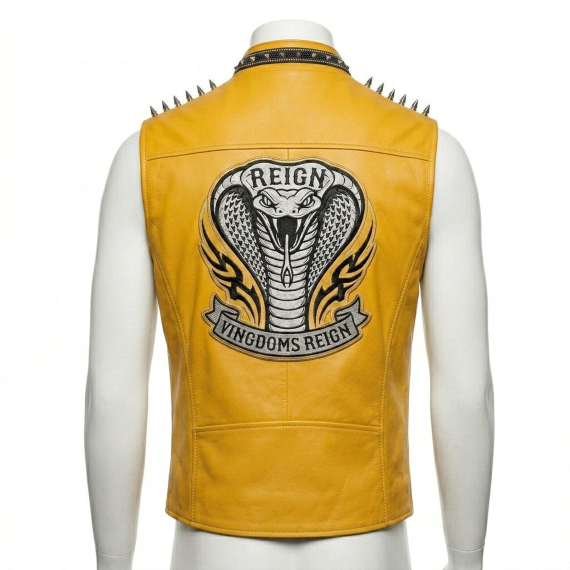 Back design of yellow leather biker vest with gothic embroidery